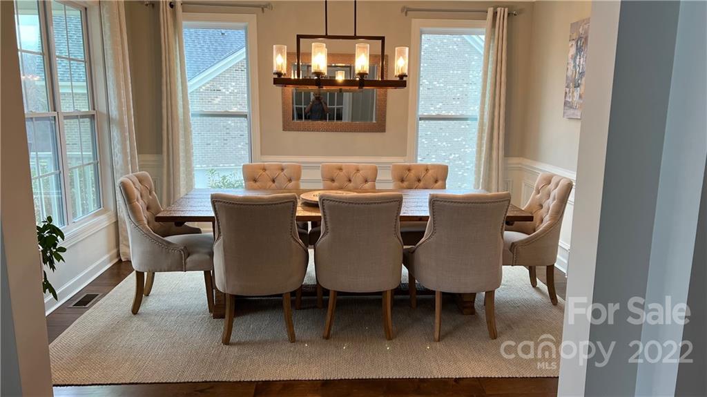 2250 Watermark Point Place, Unit 83 Fort Mill, SC 29708 - Photo 3 of 23 a view of a dining room with furniture and chandelier