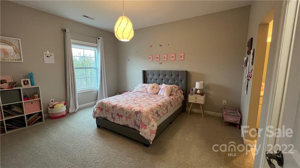 2250 Watermark Point Place, Unit 83 Fort Mill, SC 29708 - Photo 4 of 23 a bedroom with a bed and a window