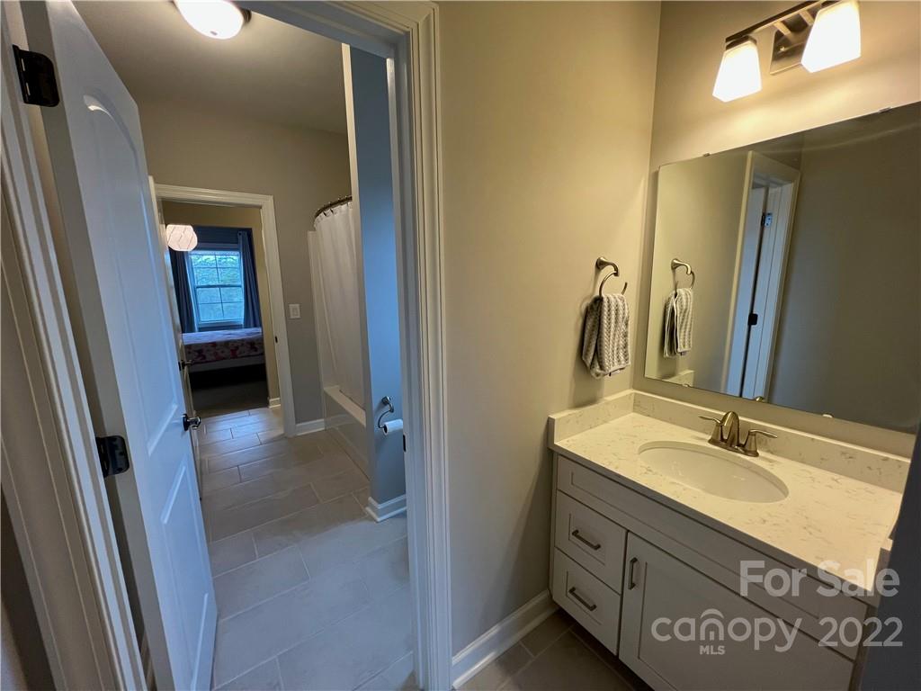 2250 Watermark Point Place, Unit 83 Fort Mill, SC 29708 - Photo 5 of 23 a bathroom with a sink a vanity and a mirror