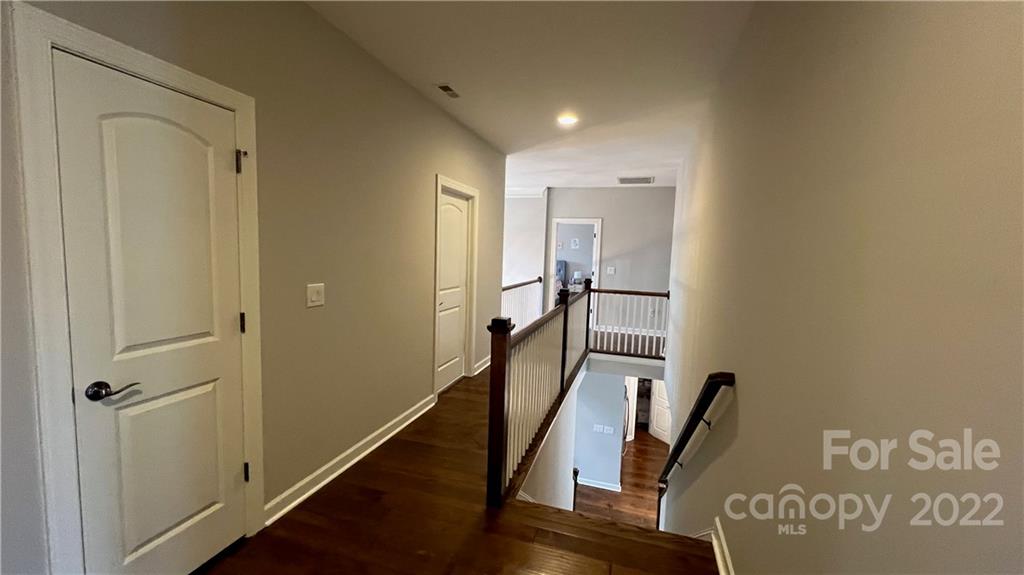 2250 Watermark Point Place, Unit 83 Fort Mill, SC 29708 - Photo 8 of 23 a hallway with wooden floor and stairs