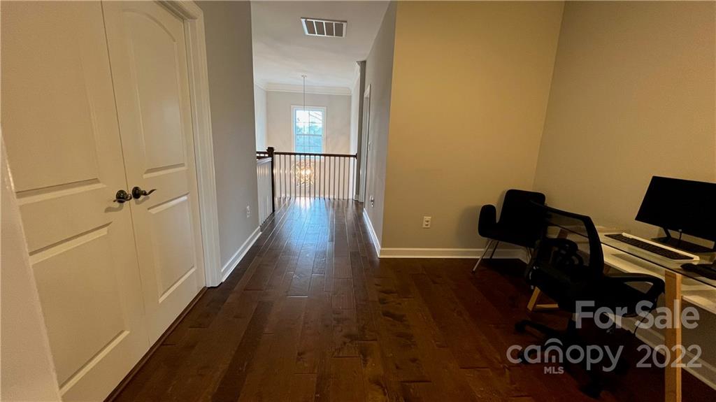 2250 Watermark Point Place, Unit 83 Fort Mill, SC 29708 - Photo 9 of 23 a view of a workspace with wooden floor and bathroom