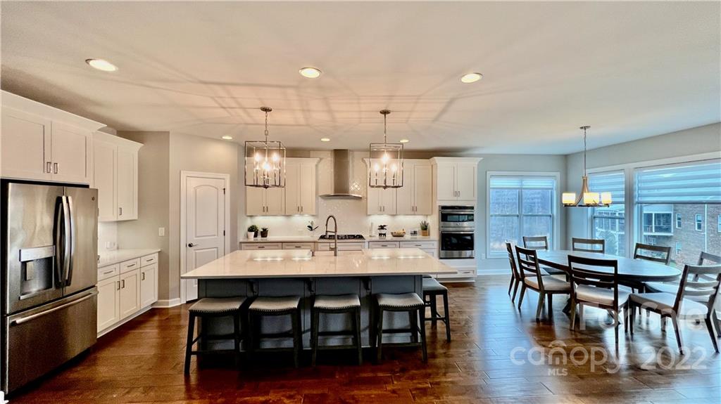2250 Watermark Point Place, Unit 83 Fort Mill, SC 29708 - Photo 10 of 23 a large kitchen with a table and chairs