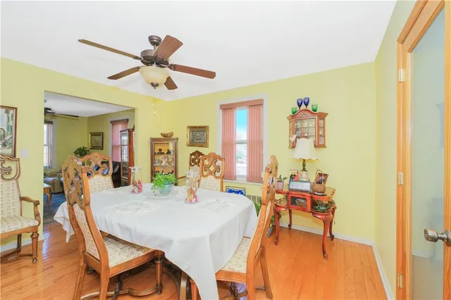 a view of a dining room with furniture and a chandelier
