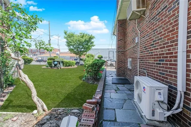 a pathway of a house with a yard