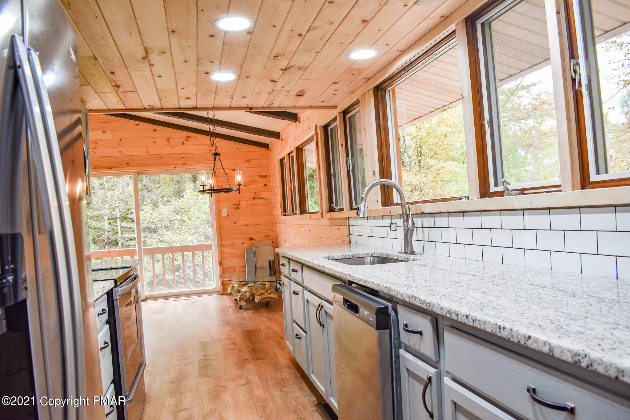 207 Sage Road Long Pond, PA 18334 - Photo 9 of 28 a kitchen with granite countertop a sink a counter top space and stainless steel appliances