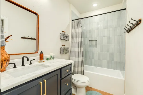 a bathroom with a sink a toilet and a bathtub