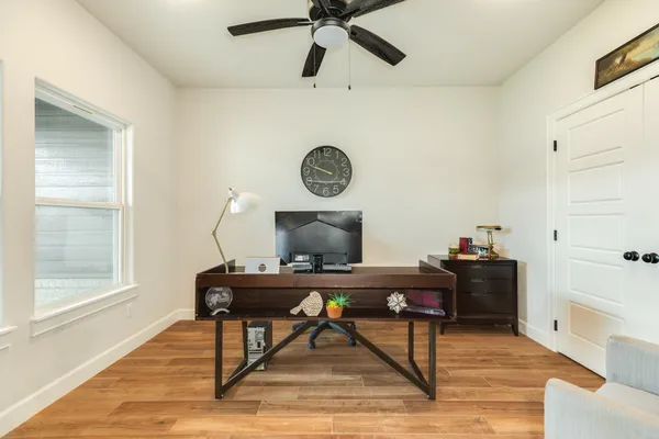 a view of workspace with wooden floor