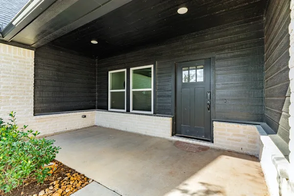 a view of entrance gate of a house