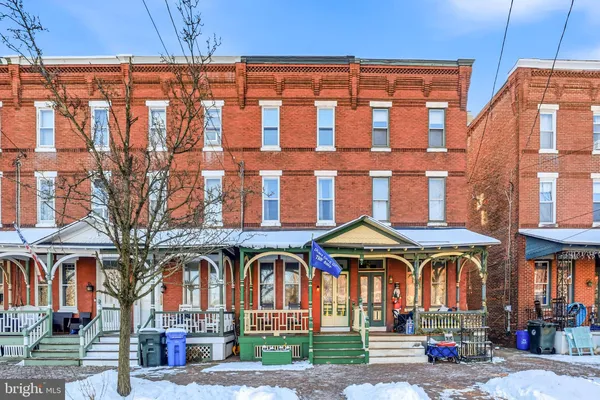 a front view of a building with large windows