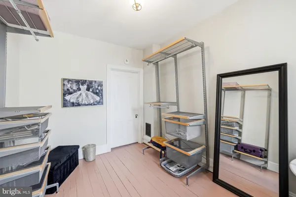 a view of work space with wooden floor and windows