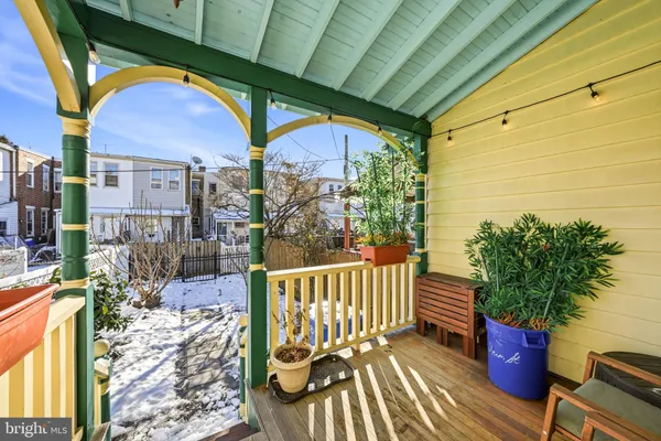 a view of a patio with table and chairs and potted plants