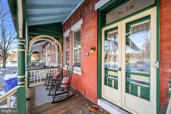 a view of a balcony with chairs