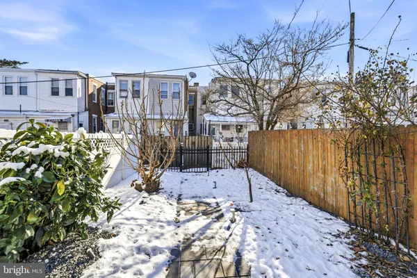 a view of a backyard with a house
