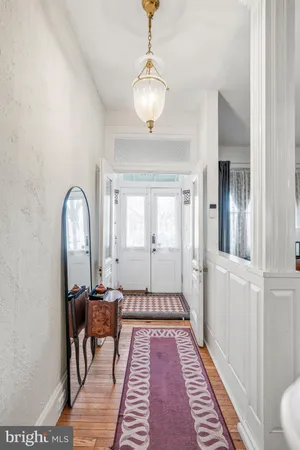 a view of a hallway with a living room