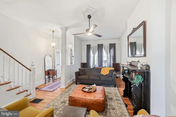 a living room with furniture and a fireplace