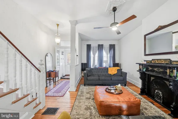 a living room with furniture and a fireplace