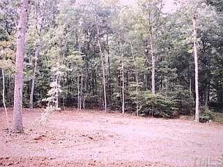 2905 Sunnystone Way Raleigh, NC 27613 - Photo 1 of 1 a row of trees