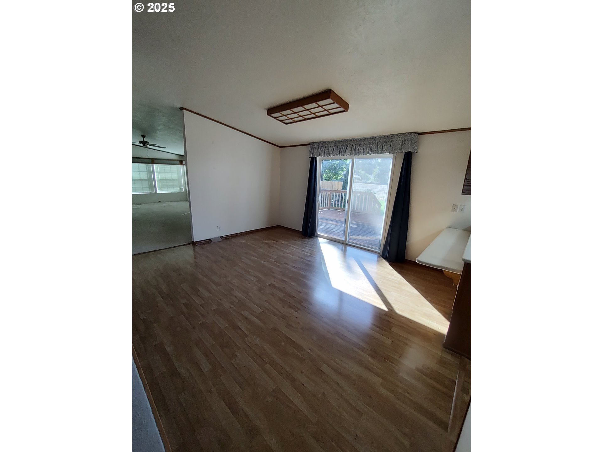 32062 Peppermint Lane Eugene, OR 97408 - Photo 3 of 8 a view of a hallway with wooden floor