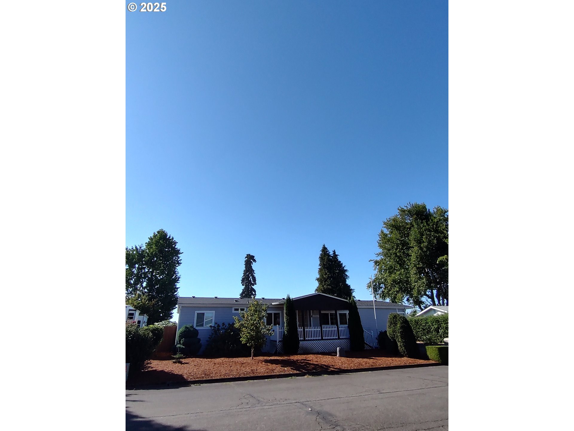 32062 Peppermint Lane Eugene, OR 97408 - Photo 4 of 8 a view of a house with a street
