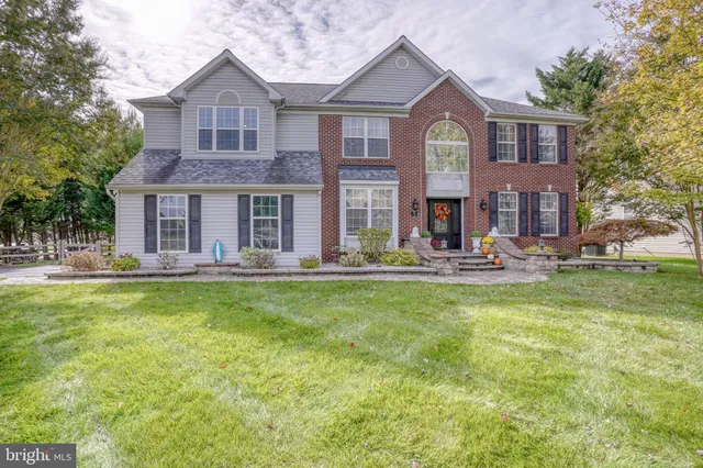 a view of a outdoor with dining table and chairs and potted plants