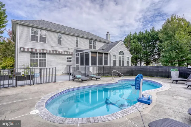 a view of an entryway with wooden floor and stairs