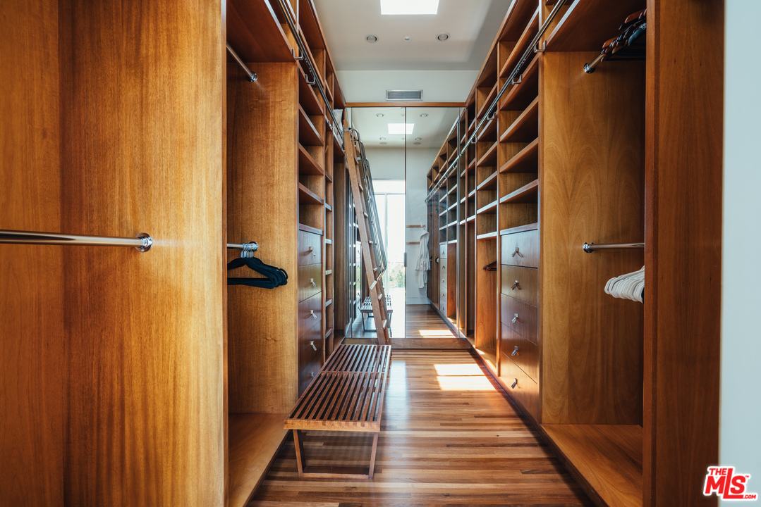 1470 Carla Ridge Beverly Hills, CA 90210 - Photo 16 of 44 a view of a hallway with wooden floor and staircase