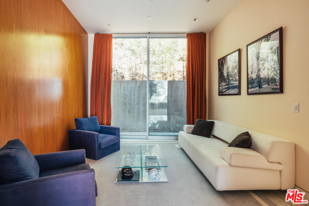 1470 Carla Ridge Beverly Hills, CA 90210 - Photo 26 of 44 a living room with furniture and a large window
