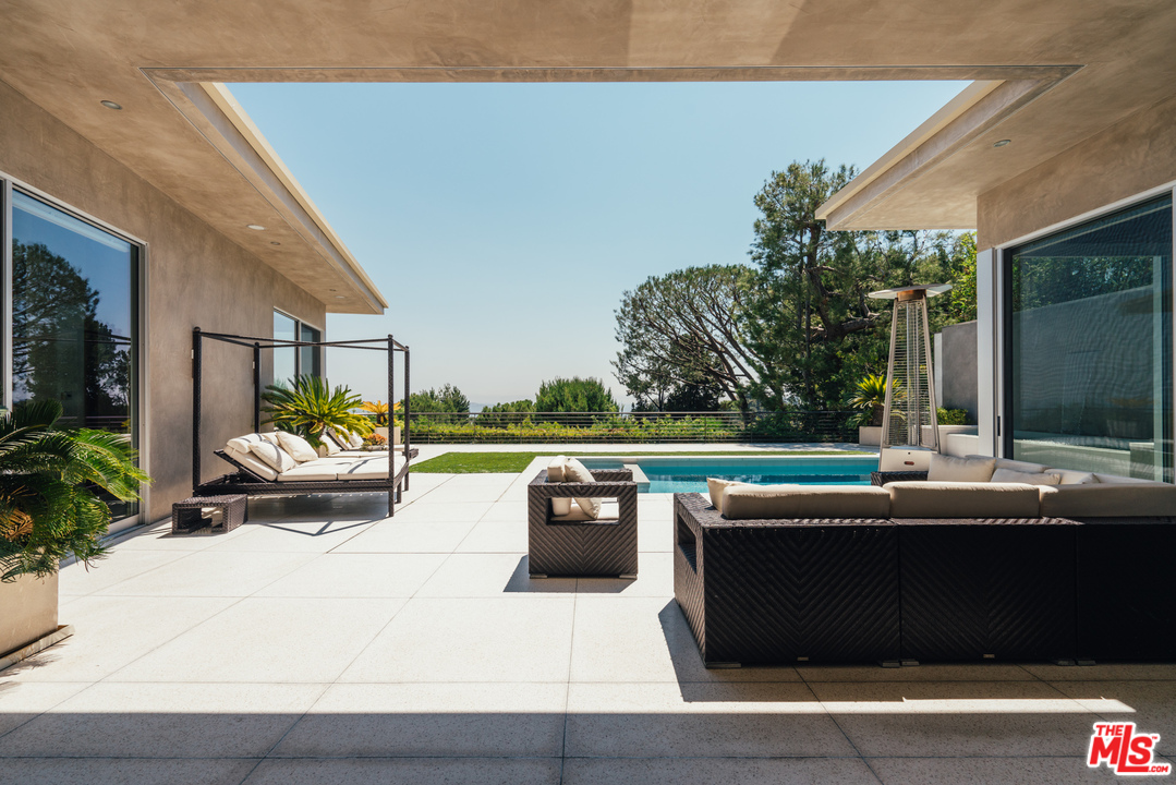 1470 Carla Ridge Beverly Hills, CA 90210 - Photo 31 of 44 a view of roof deck with couches and potted plants