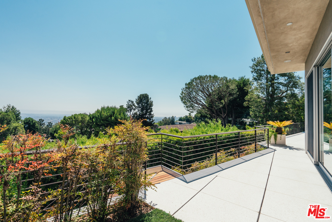 1470 Carla Ridge Beverly Hills, CA 90210 - Photo 42 of 44 a view of a bench in a balcony