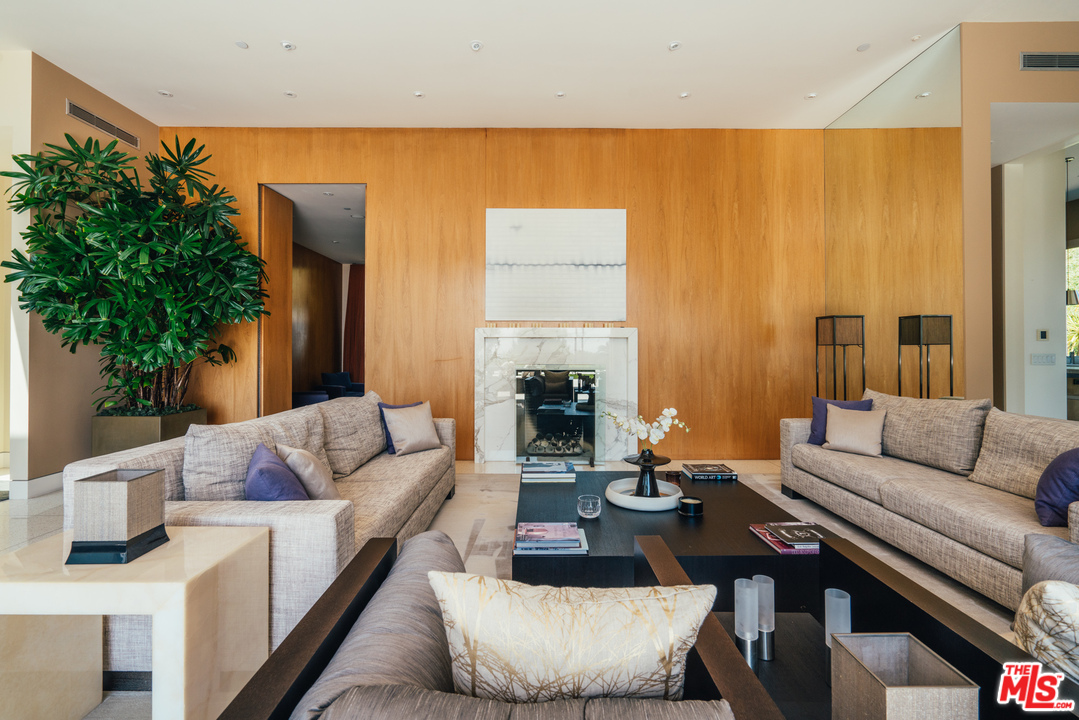 1470 Carla Ridge Beverly Hills, CA 90210 - Photo 6 of 44 a living room with furniture and a large window