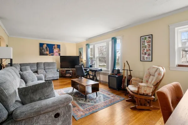 a living room with furniture and a flat screen tv