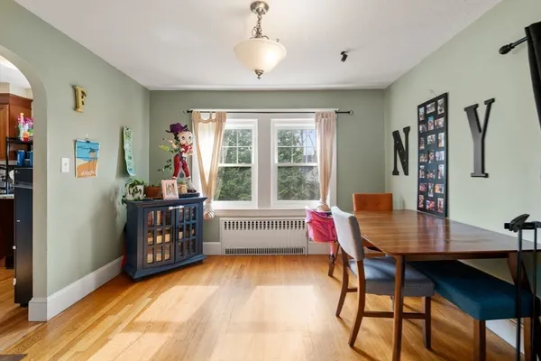 a workspace with wooden floor and windows