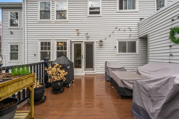 a view of a patio with couches and potted plants