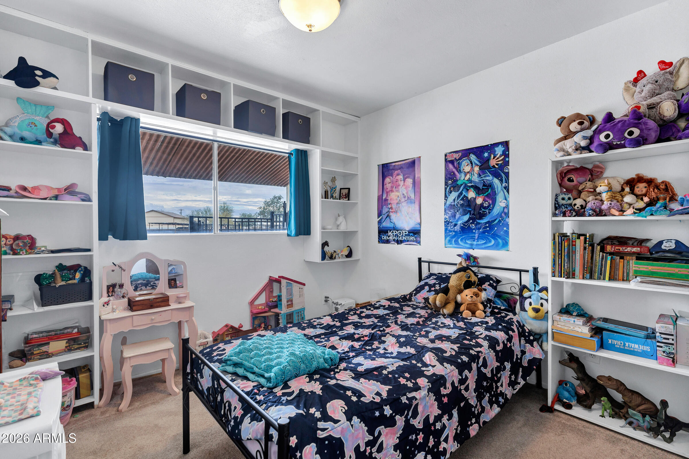 6618 North Evans Road Coolidge, AZ 85128 - Photo 22 of 48 a bed room with furniture and a window
