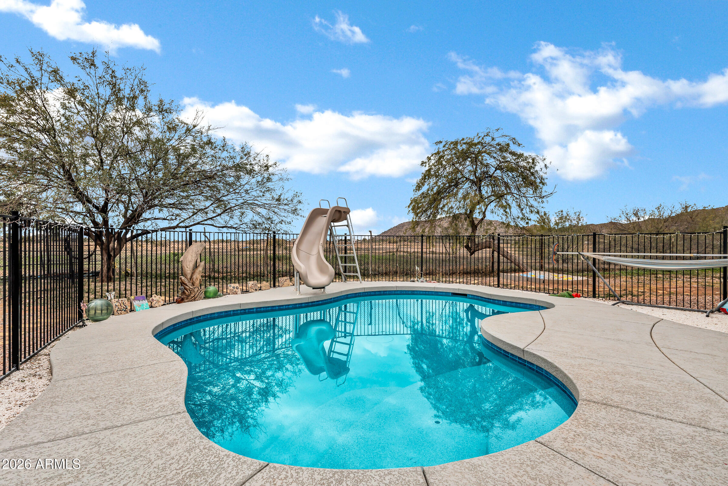 6618 North Evans Road Coolidge, AZ 85128 - Photo 28 of 48 a view of a swimming pool with a patio