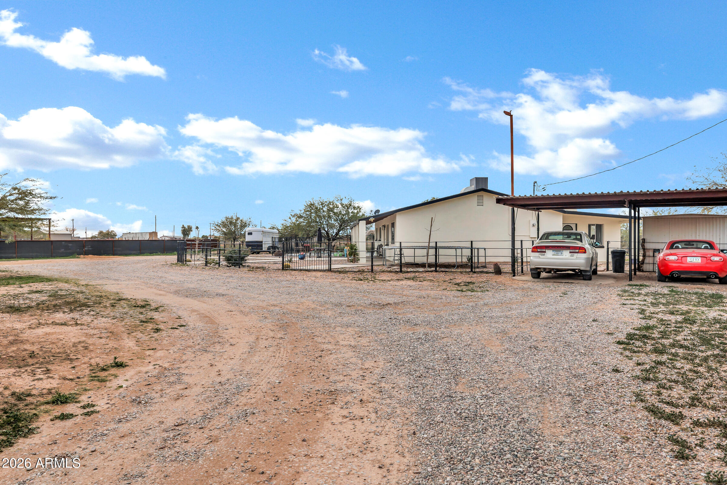 6618 North Evans Road Coolidge, AZ 85128 - Photo 35 of 48 a car parked on the side of the road