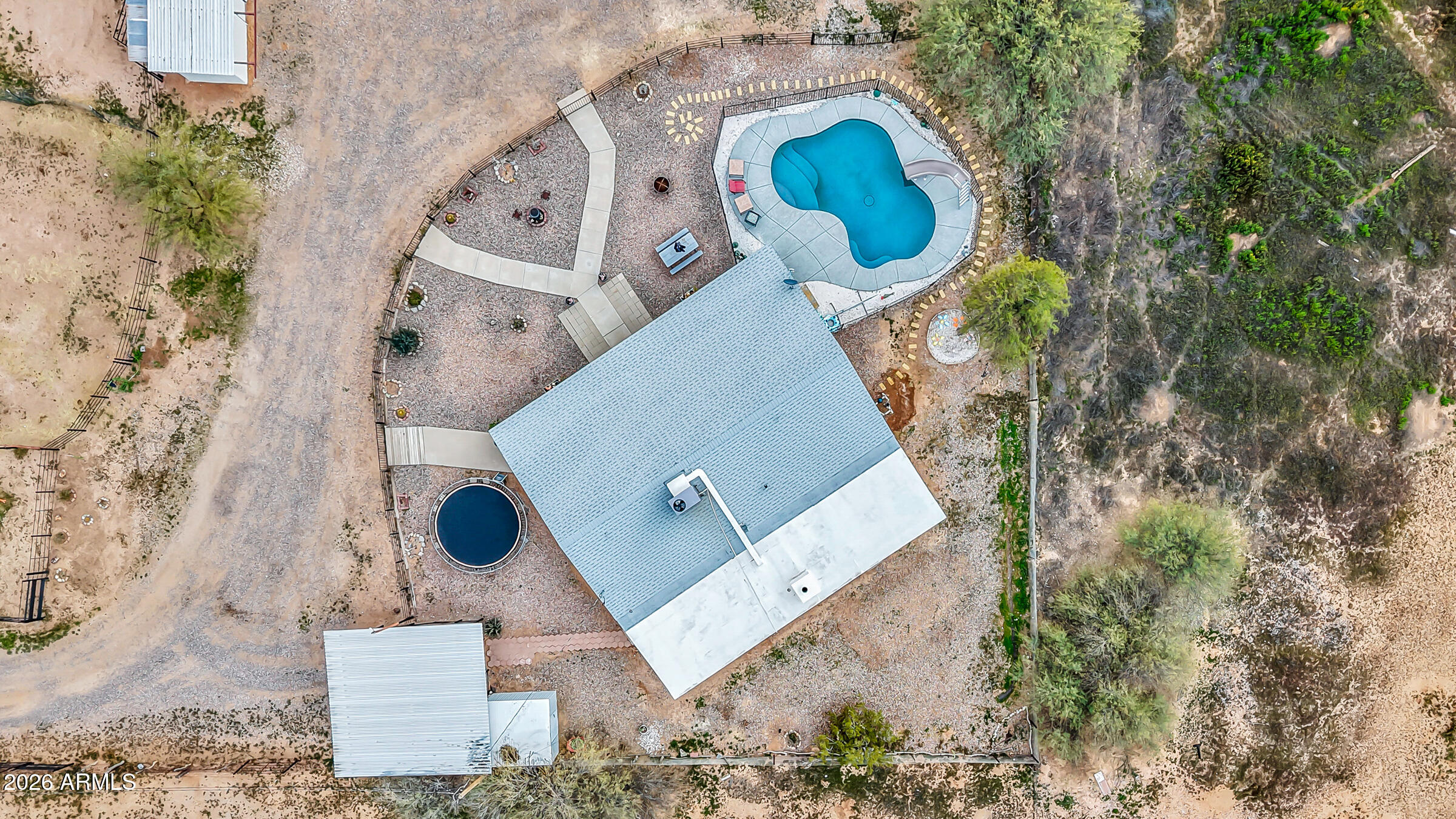 6618 North Evans Road Coolidge, AZ 85128 - Photo 45 of 48 an aerial view of a house with a yard and a large tree