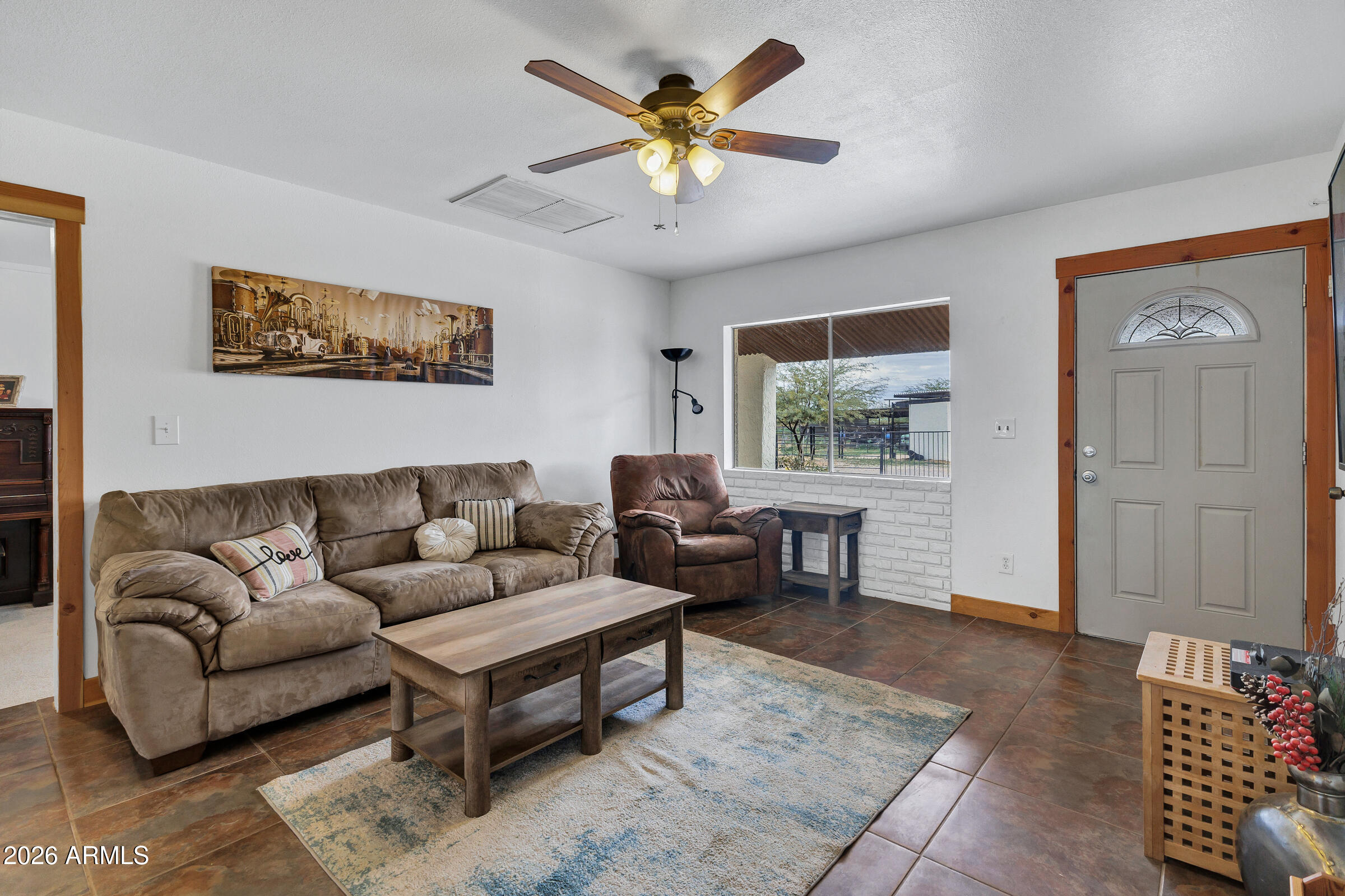 6618 North Evans Road Coolidge, AZ 85128 - Photo 6 of 48 a living room with furniture and a window