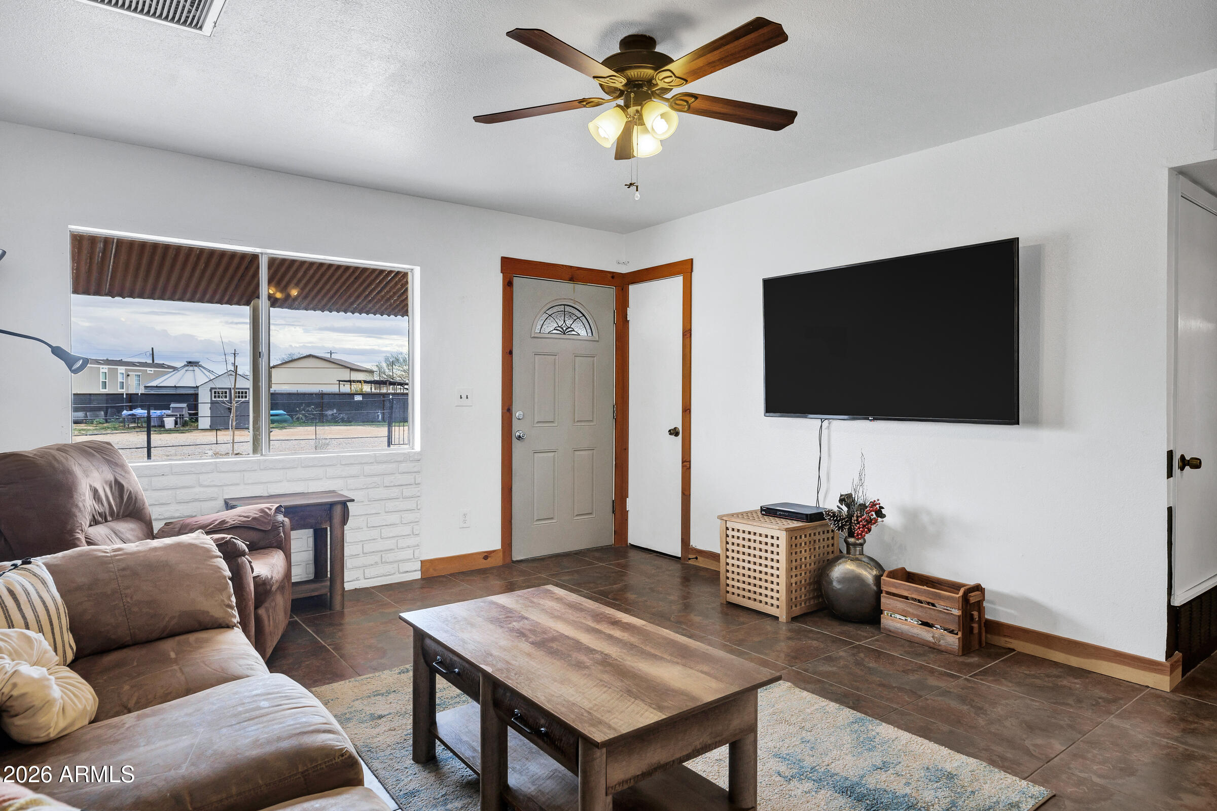 6618 North Evans Road Coolidge, AZ 85128 - Photo 7 of 48 a living room with furniture and a flat screen tv