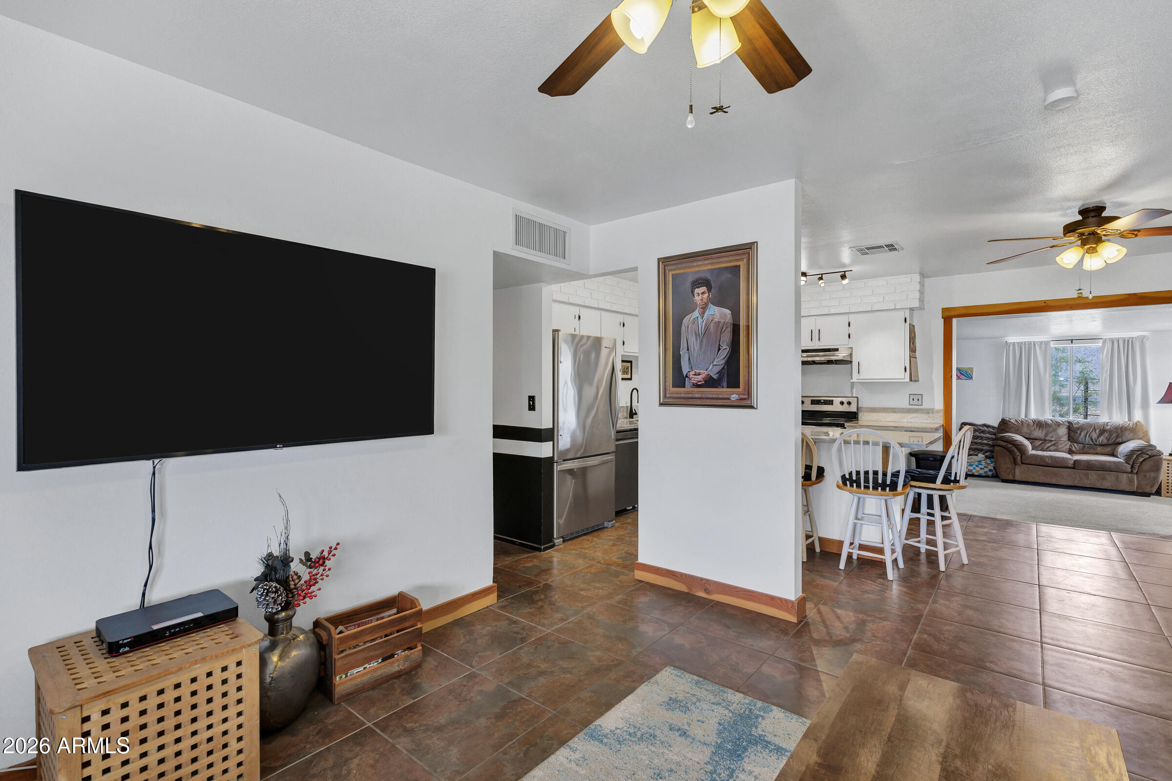 6618 North Evans Road Coolidge, AZ 85128 - Photo 8 of 48 a living room with furniture and a flat screen tv