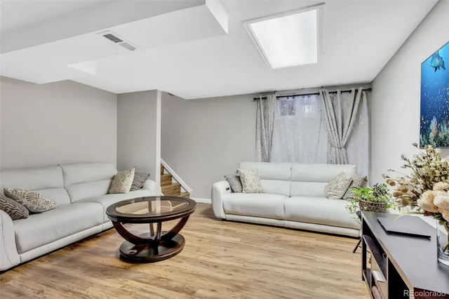 a view of a dining room with furniture and window