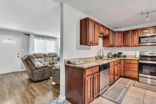 a bedroom with furniture and a chandelier