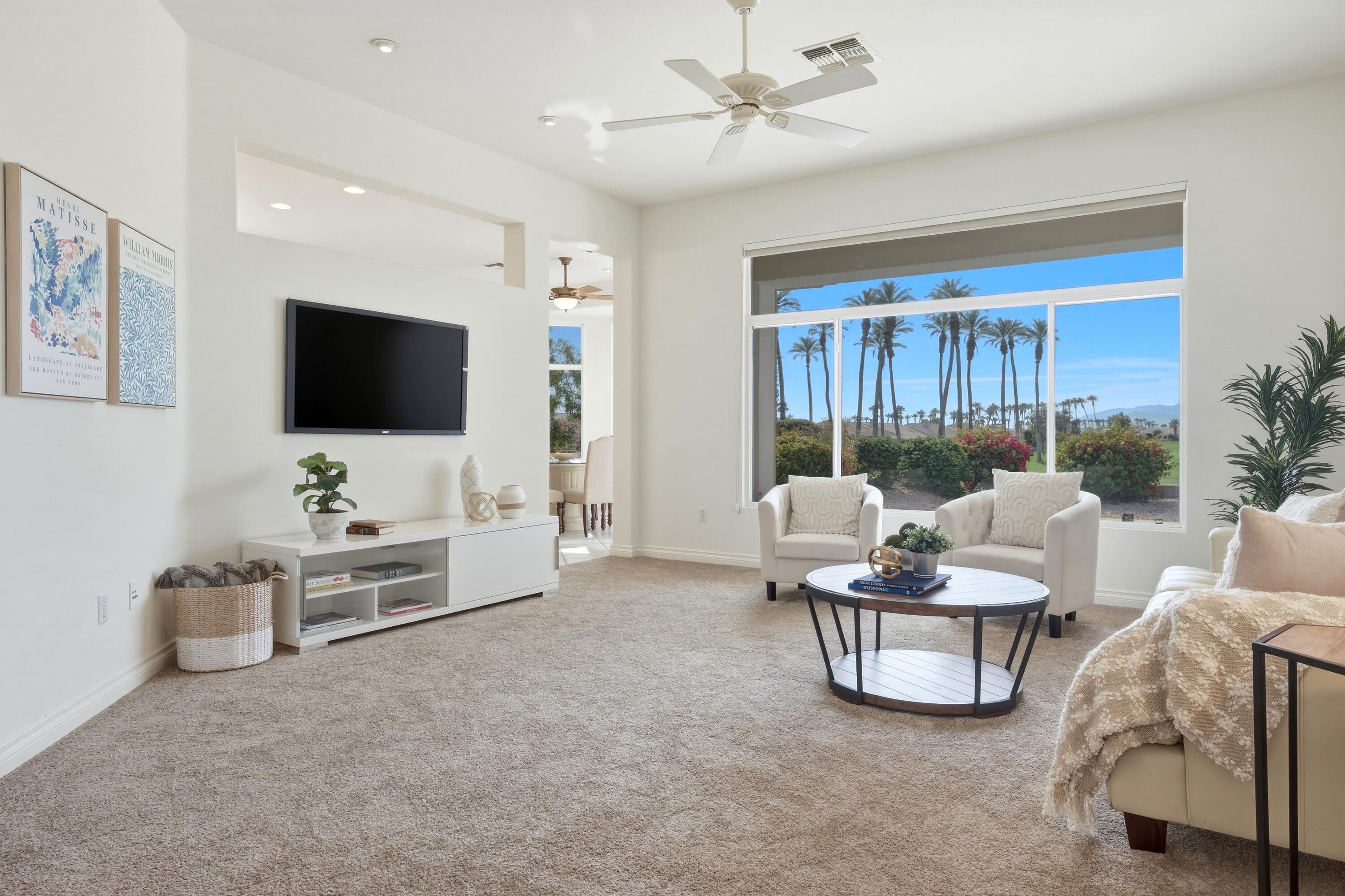 35440 Moorbrook Road Palm Desert, CA 92211 - Photo 9 of 32 a living room with furniture and a flat screen tv