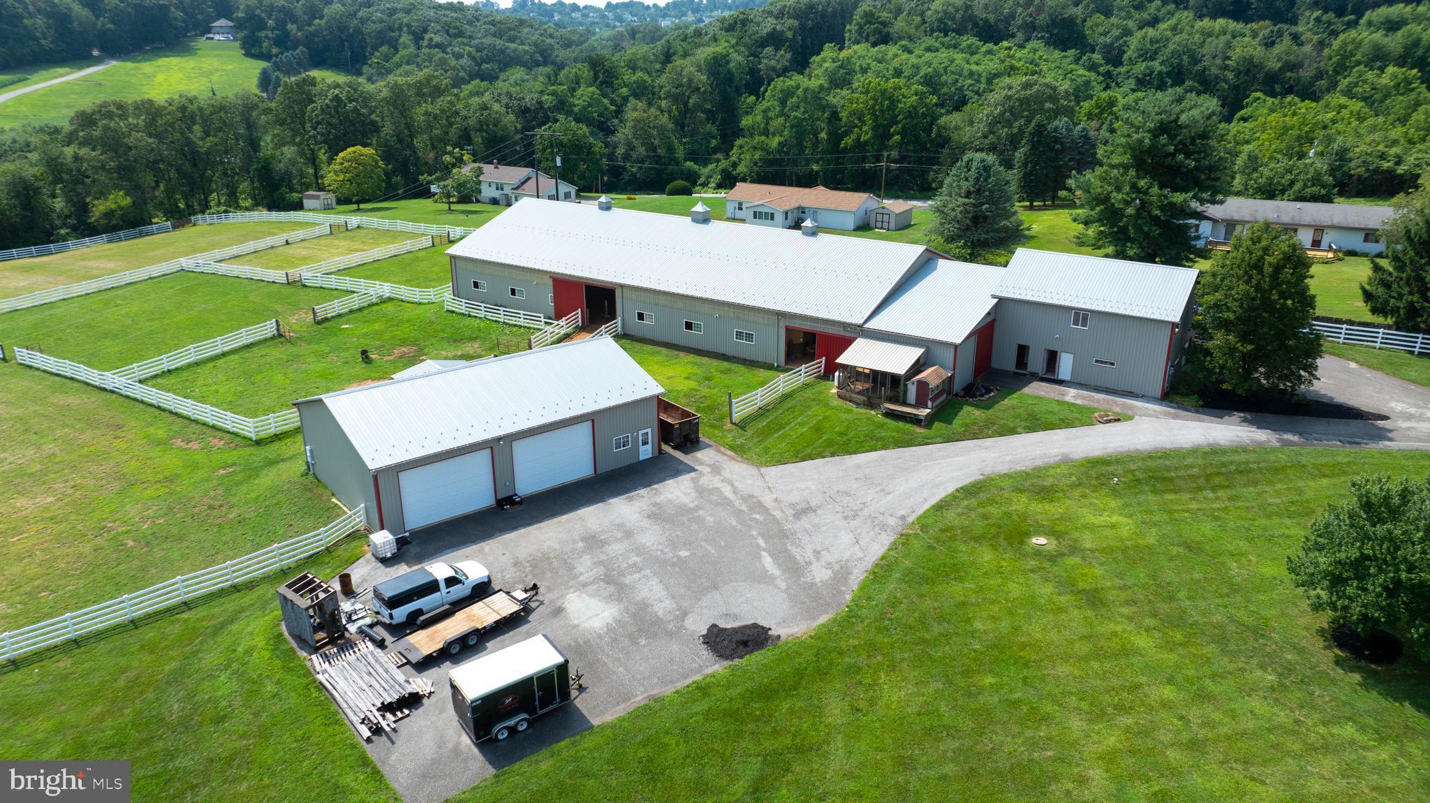 18183 Piedmont Road Stewartstown, PA 17363 - Photo 57 of 81 an aerial view of a house with pool a big yard and large trees