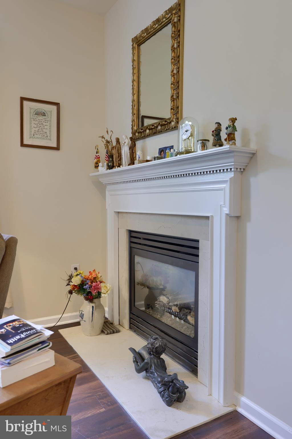 18183 Piedmont Road Stewartstown, PA 17363 - Photo 78 of 81 a living room with a fireplace and a wooden floor
