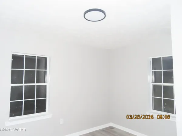a view of a room with windows