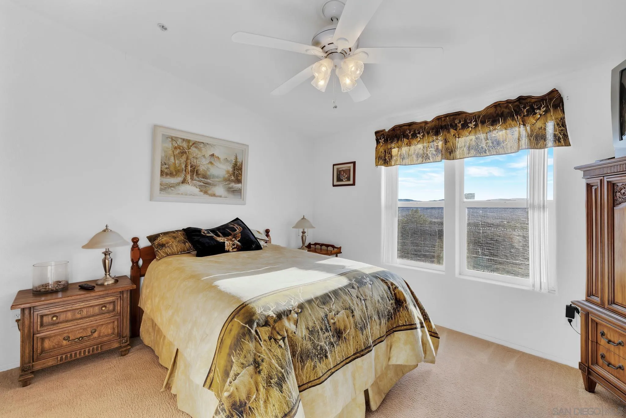 3240 Chimney Rock Road Ranchita, CA 92066 - Photo 12 of 34 a spacious bedroom with a bed a window and painting on the wall