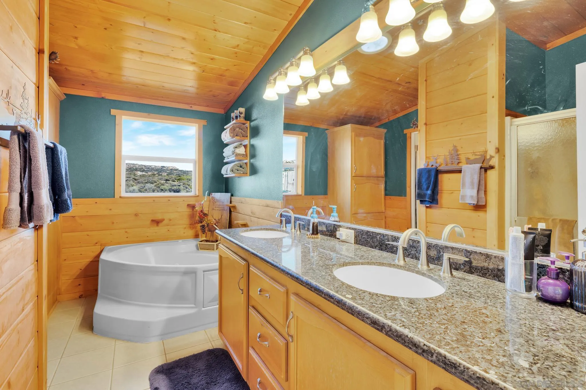 3240 Chimney Rock Road Ranchita, CA 92066 - Photo 17 of 34 a bathroom with a granite countertop sink and a mirror