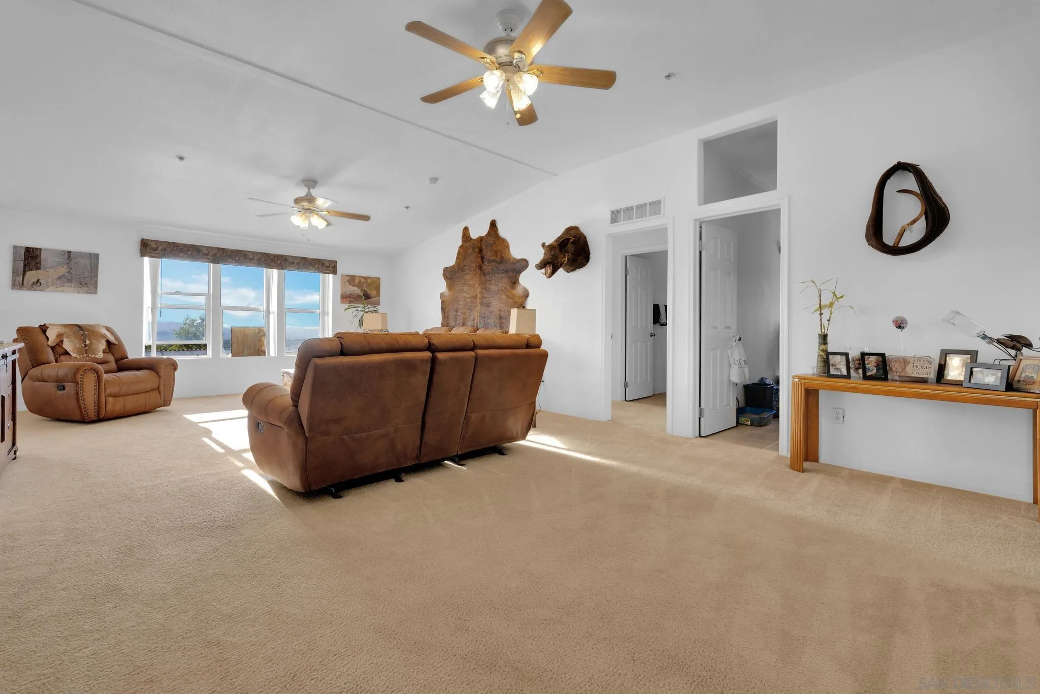 3240 Chimney Rock Road Ranchita, CA 92066 - Photo 3 of 34 a living room with furniture a ceiling fan and a window
