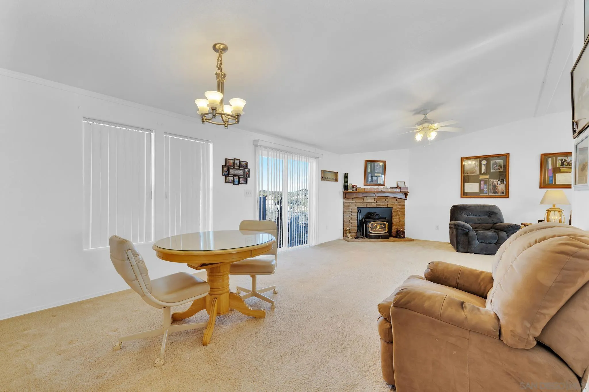 3240 Chimney Rock Road Ranchita, CA 92066 - Photo 8 of 34 a living room with furniture a fireplace and a chandelier